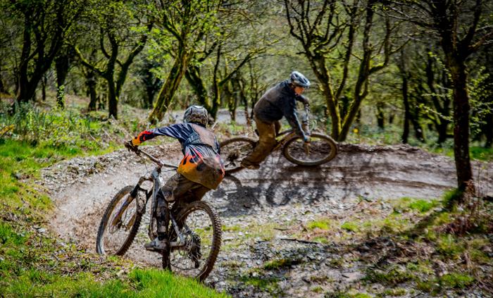 Two teenage riders shredding in the sunshine